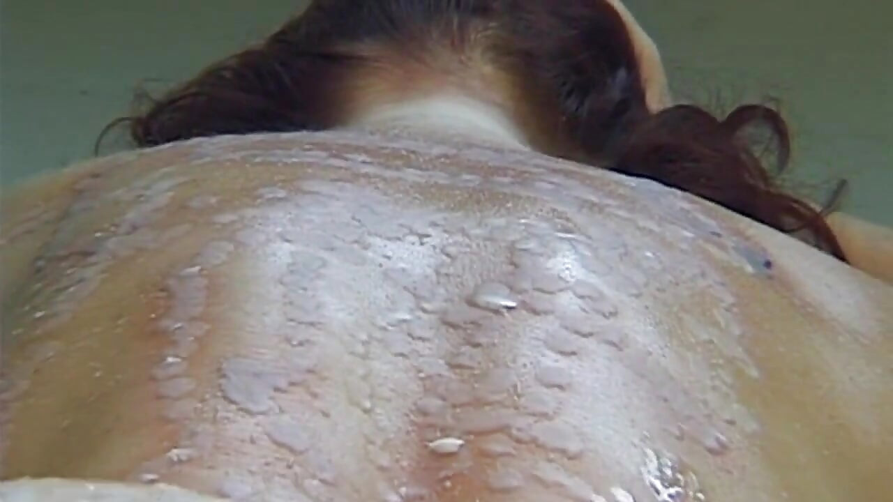 Mature MILF Enjoys Hot Wax Dripping Across Her Ass