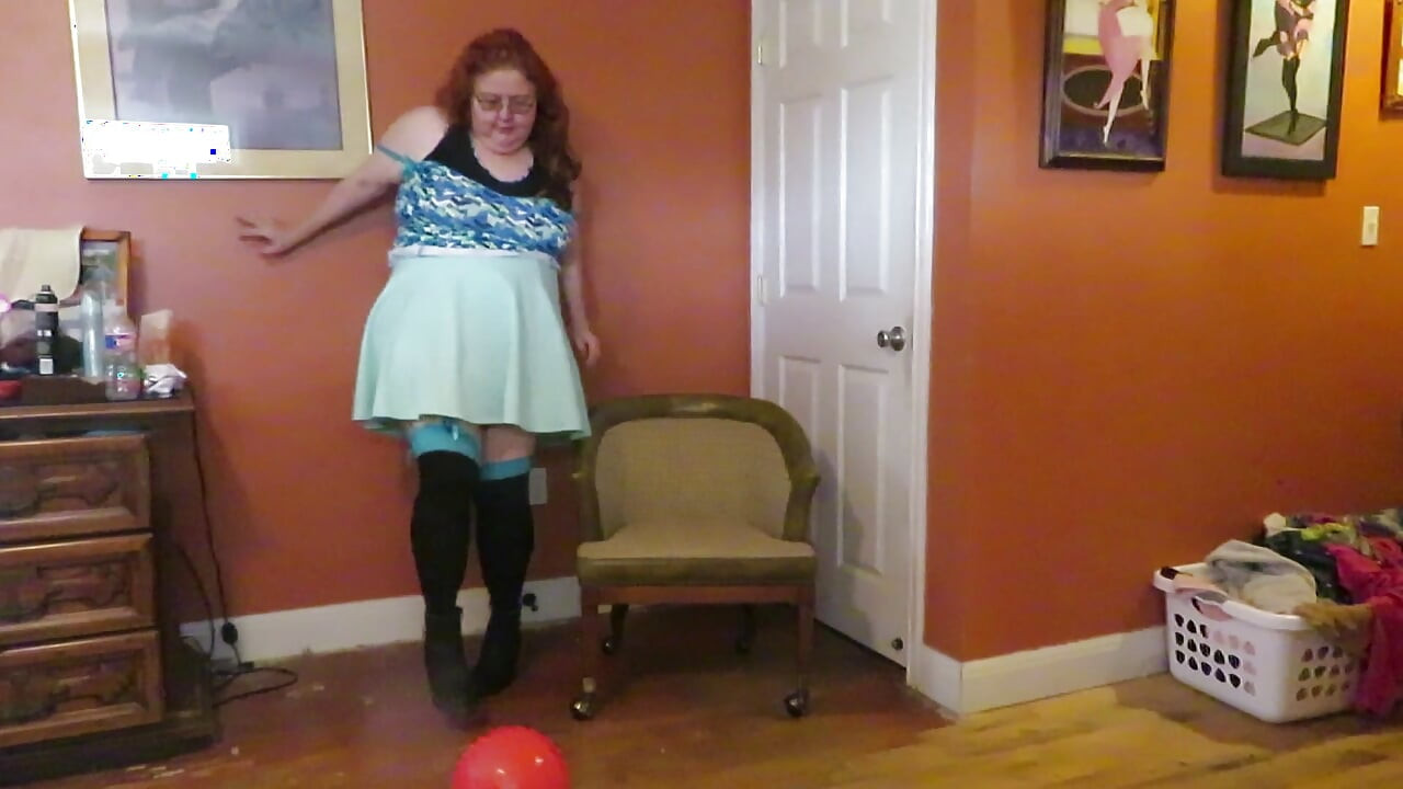 Nurse Vicki  plays with a rubber ball in a mini skirt, sexy stockings and high heel mini boots