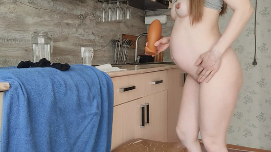 Hardcore dildo in the pussy of a pregnant beauty