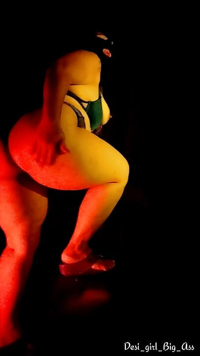 An Indian couple having intense sex in a dark room.