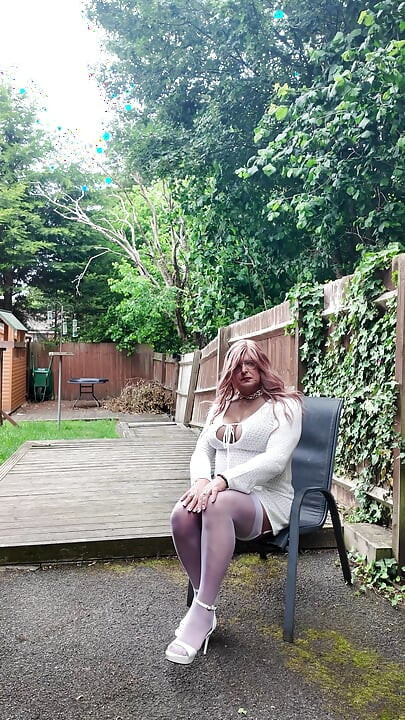 Crossdresser kellycd in white dress stockings and heels