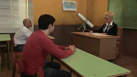 Teacher Rewards His Students at the Desk