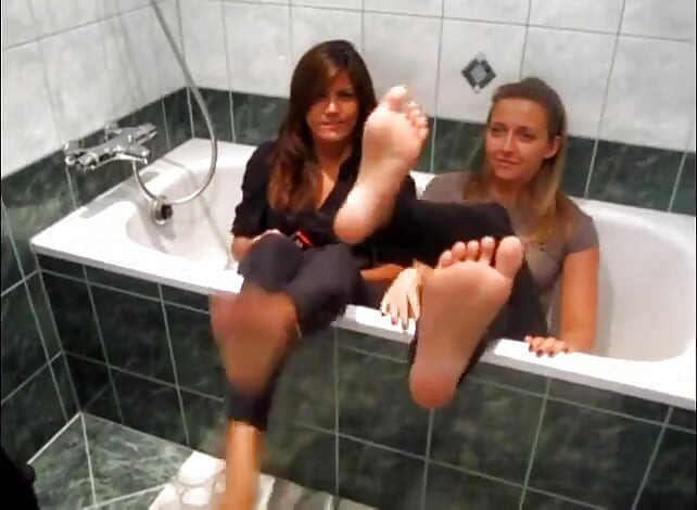 Two sexy teen lesbians in bathroom plays with their feets