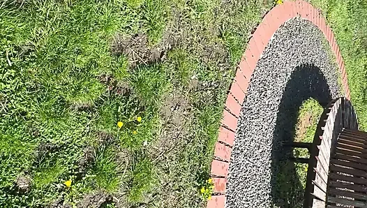 Sexy hot stepmom is horny and caresses herself on a park bench