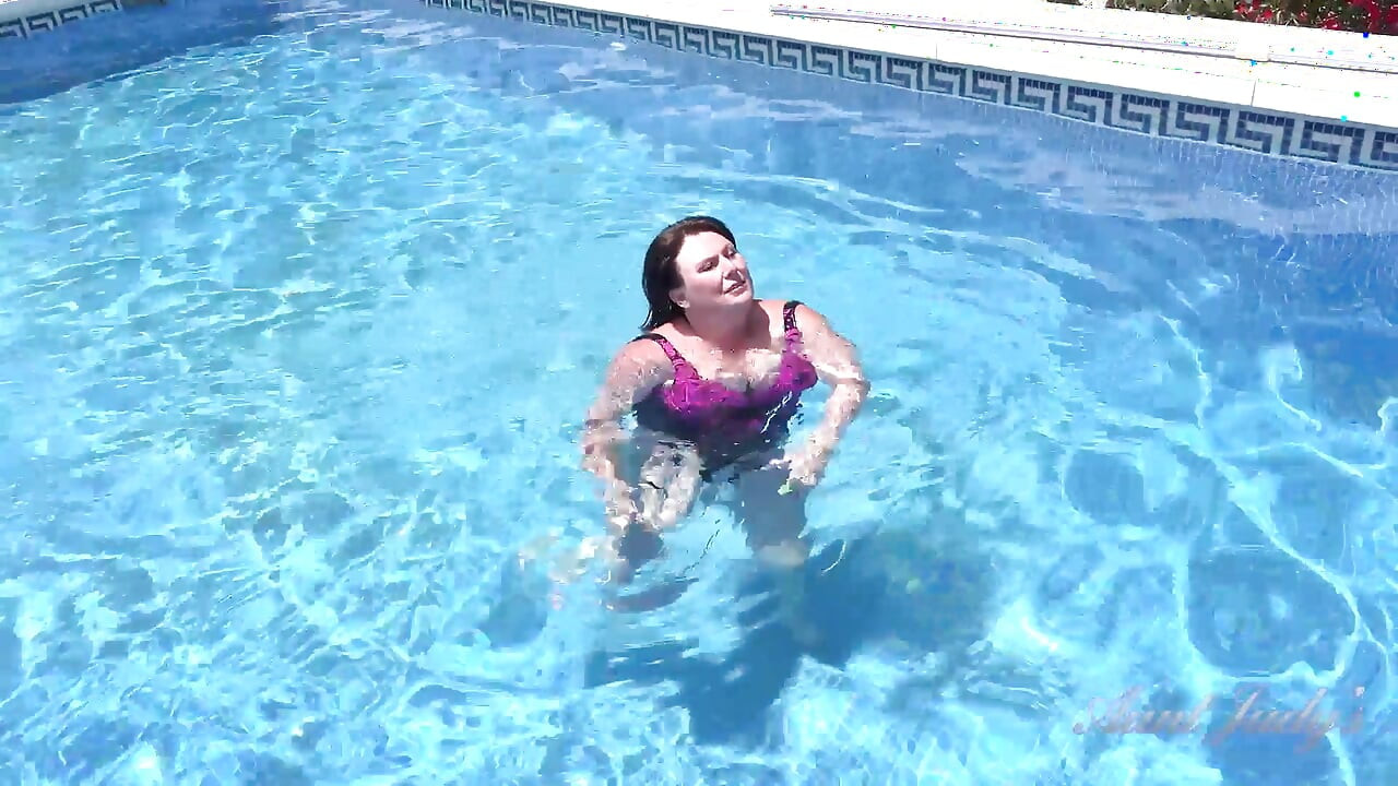 Busty Redhead MILF JoJo Robinson Goes Skinny Dipping in the Pool