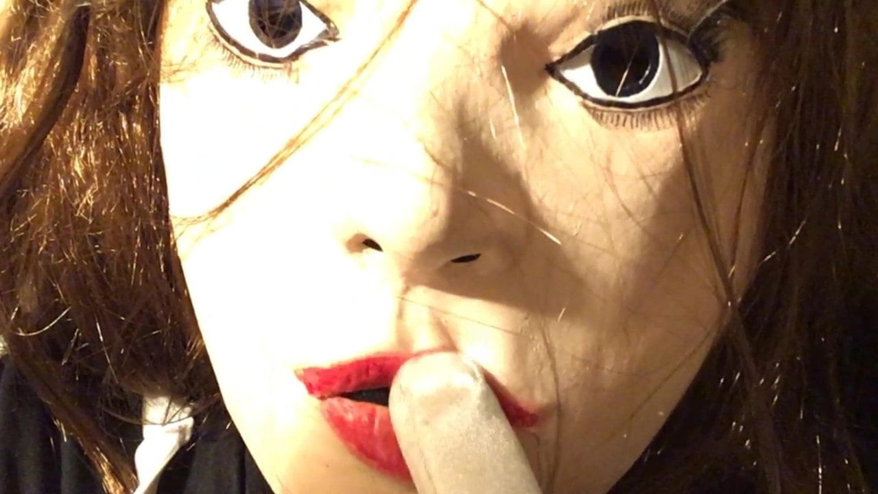 Female mask doll relaxing