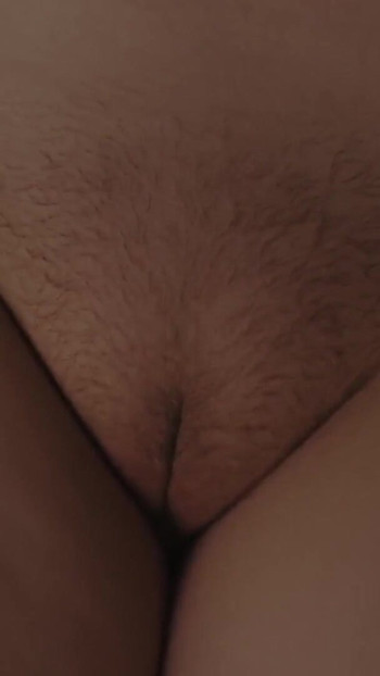 Key moment from "Nighttime marital sex. Close-ups of a hairy pussy."
