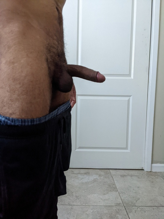 Spreading ass and jacking uncircumcised dick