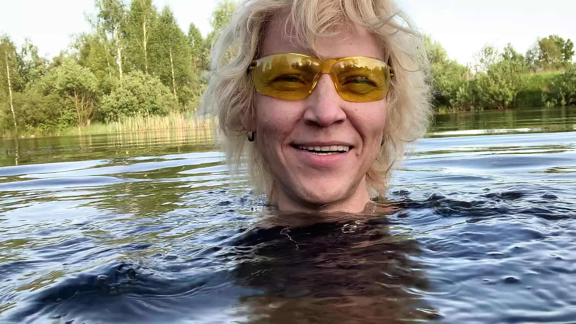 Transgirl Alexa Cosmic soaking and swimming in denim shorts and top and nude in the lake