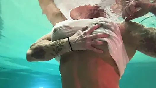 Amazon Kandy Flexes Her Massive Biceps in Her Hotel Pool