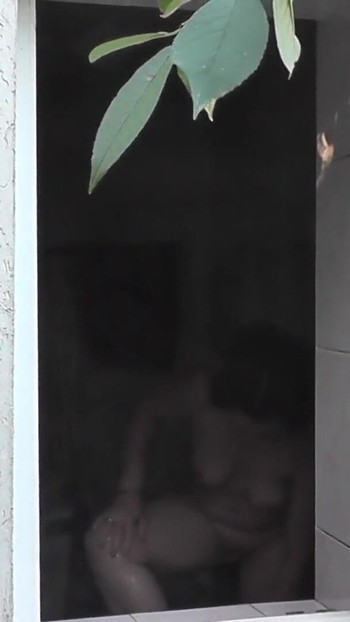 Thrilling moment from "Outside - young neighbor watches Milf taking Shower"