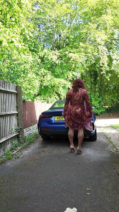 Crossdressing kellycd2022 enjoying the lovely warm weather in nylon and heels