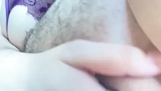 Close-up Latina in violet lingerie touching non-stop