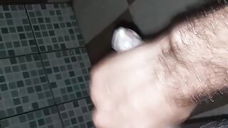 boy masturbates while listening to Chinese music in the bathroom