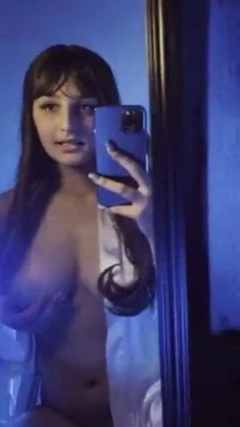 Agreeable sexy brunette and her smartphone