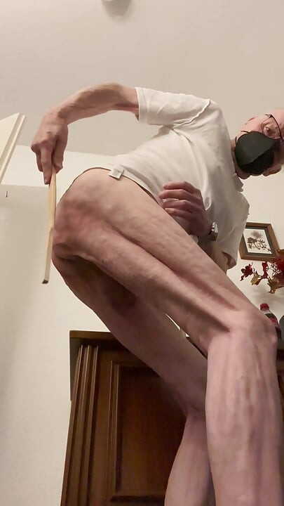The old man punishes himself with his hand, with the stick, electric shock, self-punishment