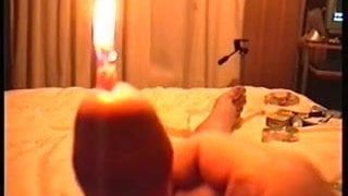 Burning candle in peehole