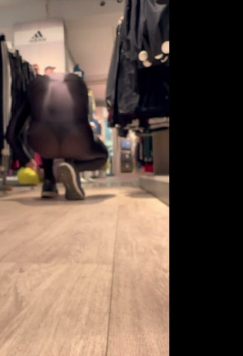 In a see-through bodysuit in the sports shop