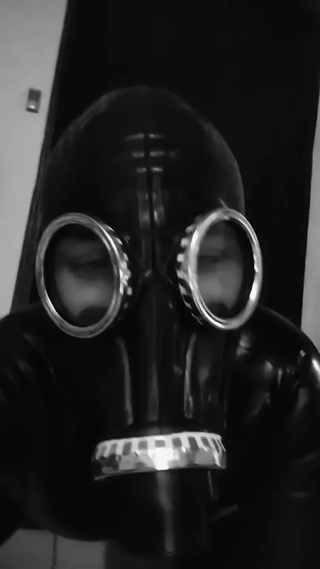 Rubber slave play with big dildo