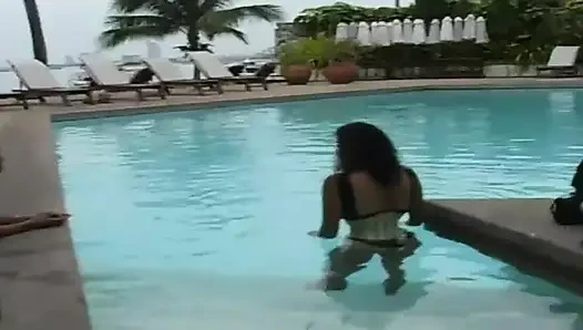 2 sexy Latina's presenting latex fetish in the pool and on the beach