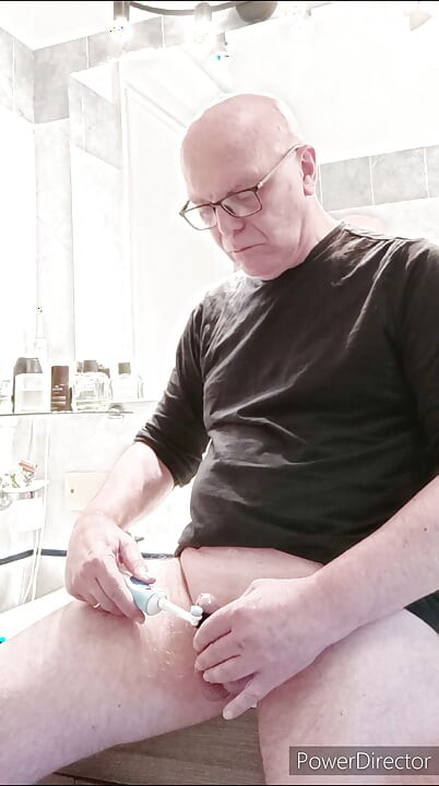 small caged cock and toothbrush