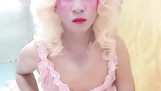 Oanh Le transgender wearing sexy porn clothes playing with a fake can