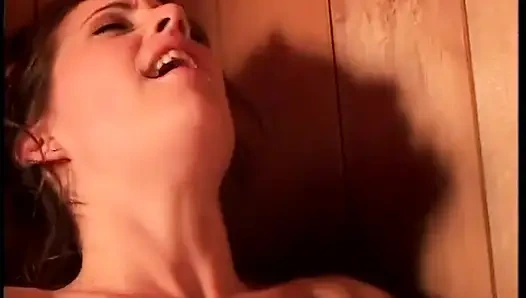 Hot, tight lesbian babes play with a double headed dildo in the sauna