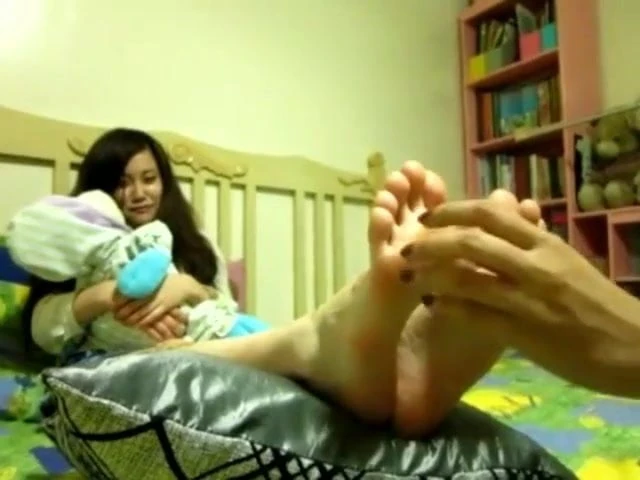 mum tickles step daughters feet