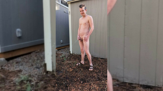 Nude guy in sandals peeing freely outside in the open air