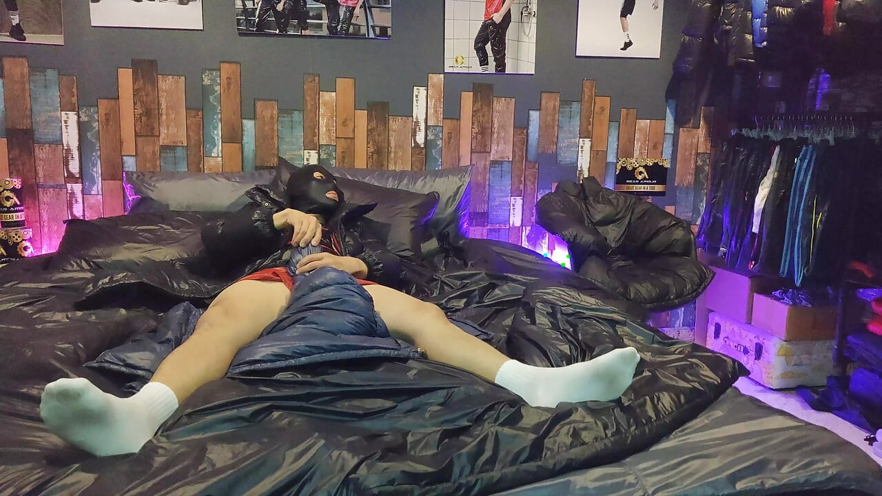 Cock Rubbing Down Jacket on Shiny Nylon Bed