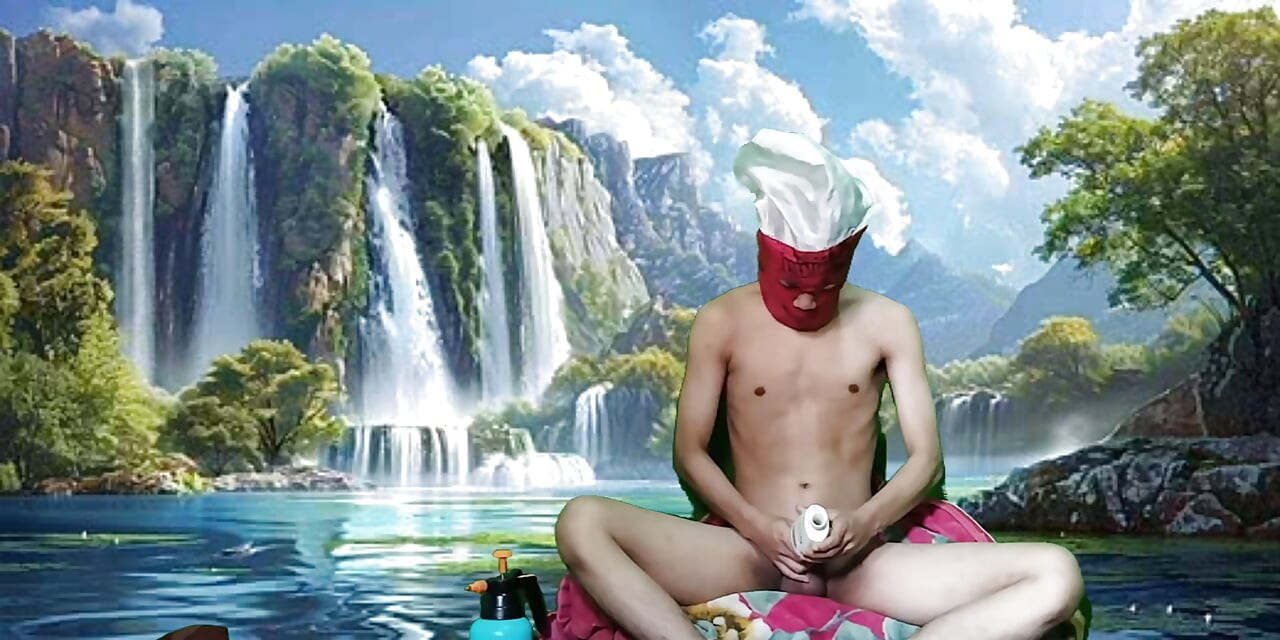 Masturbating with a dildo made from a bottle, used under a waterfall.