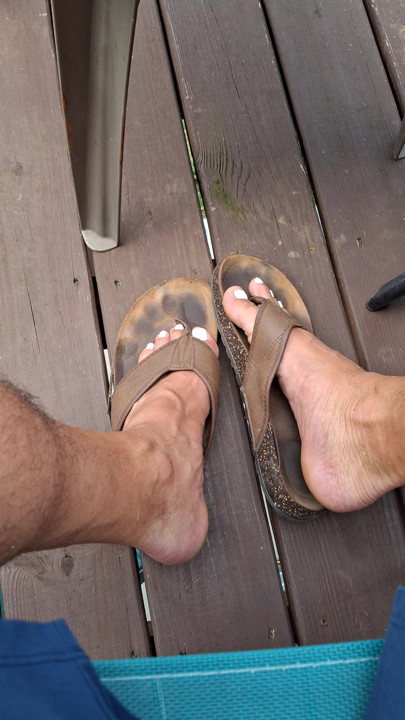 Showing off my dirty worn leather sandals and my cute painted toes