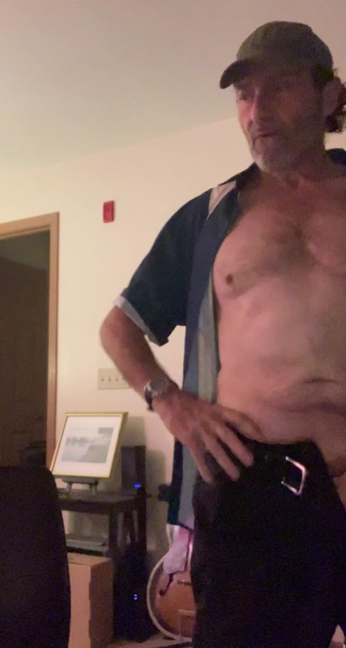 Just a guy getting home from work and getting naked.