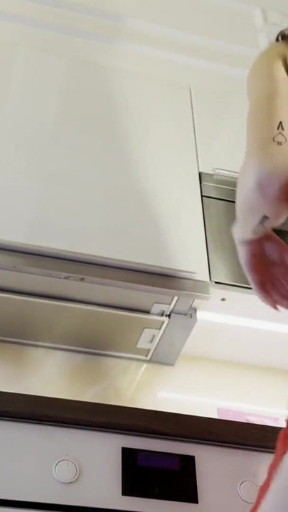 Jaw-dropping moment from "Hot sexy redhead college girl with her long legs and cotton panties in the kitchen gets bored and"