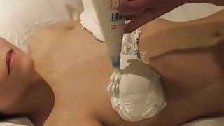 Home made personal shooting: Decorate the boobs of a busty beauty with fresh cream and lick off the cream.