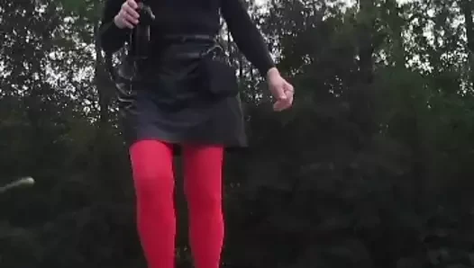 Crossdress walk outdoors by traffic.