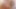 セクシーな女が巨大なペニスが剃った秘部を突き刺す中、快感に喘ぐ