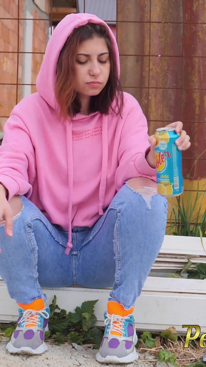 Hipster girl pee in her jeans - changing her wet shorts into dry pants
