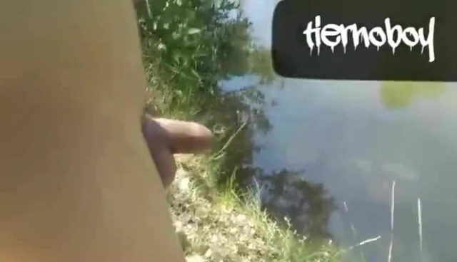 Naked Twink In The River Is Pissing And Cumming