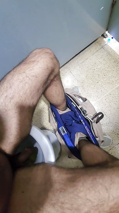 Masturbating in a public bathroom