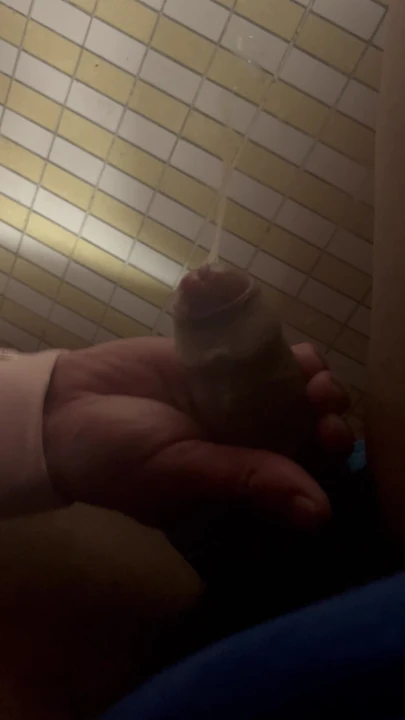 Under-stall bathroom handjob and cum shot