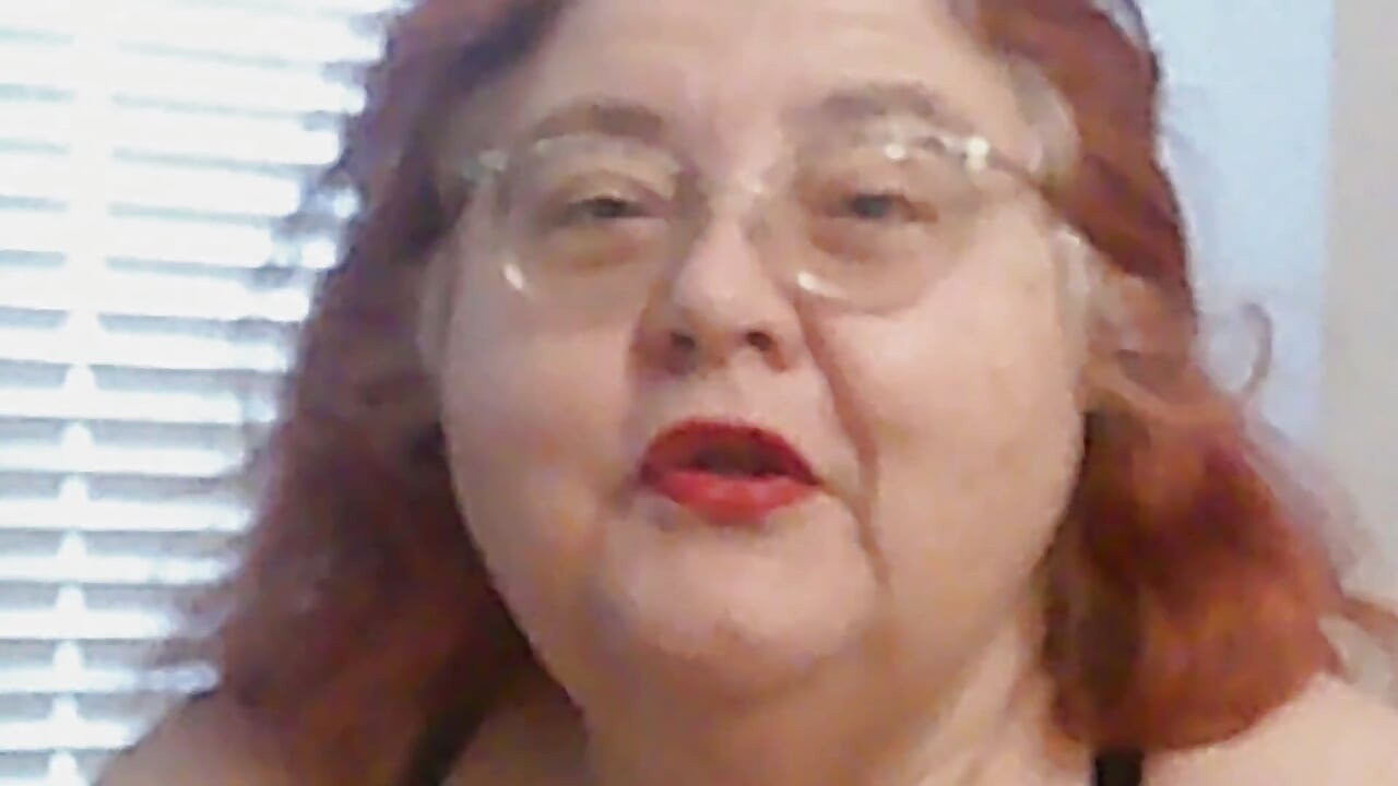Mature BBW Redhead Nurse Vicki Talks to You as She Makes a Lipstick Applying Video for You!