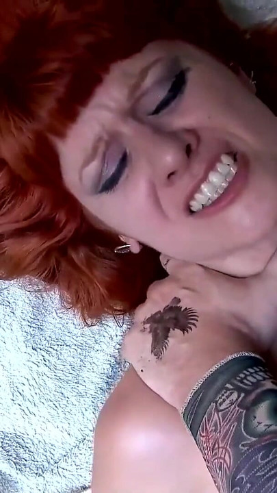 Emotional moment from "Redhead with pierced big nipples joined by horny couple"