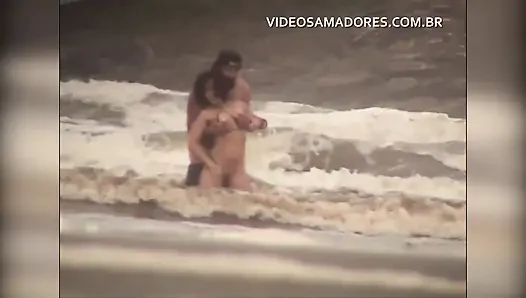 Shameless couple has sex in the shallow sea