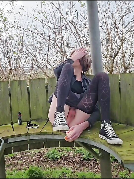 Riding dildo outdoor on bench