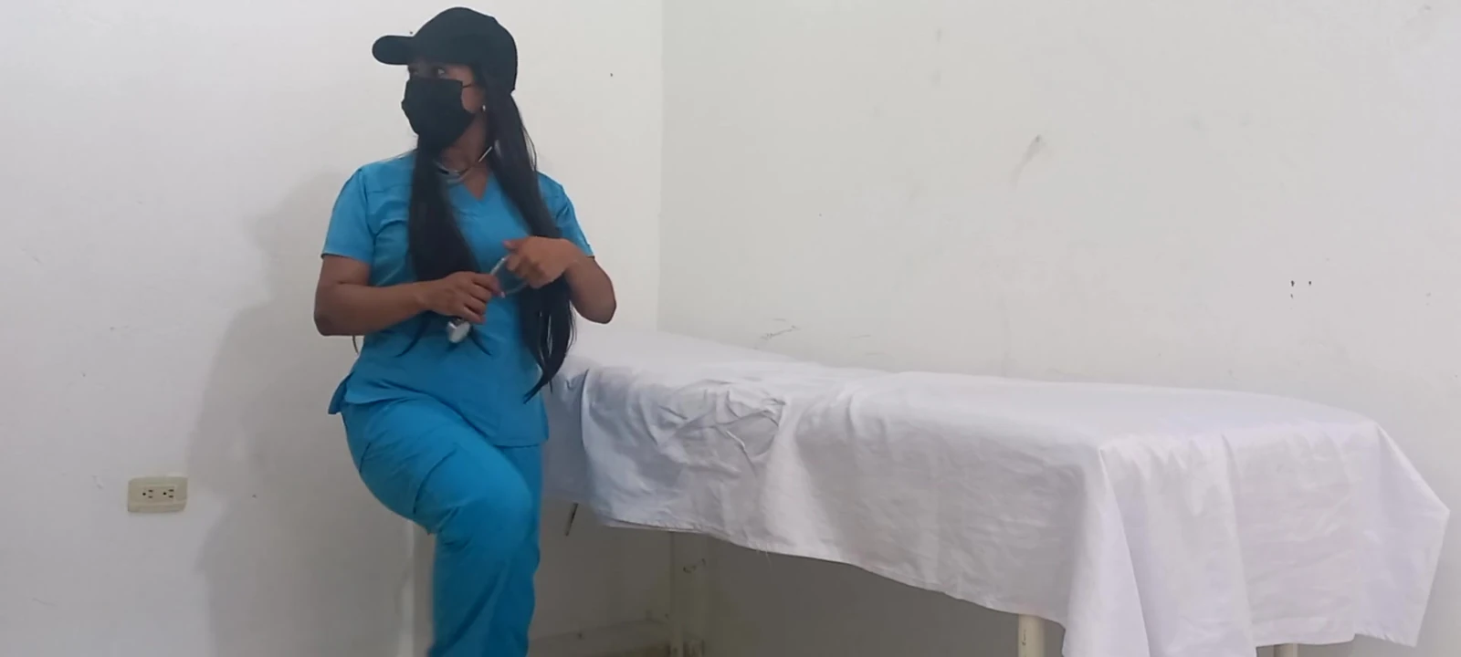My nurse massages her pussy and moans with pleasure in her office