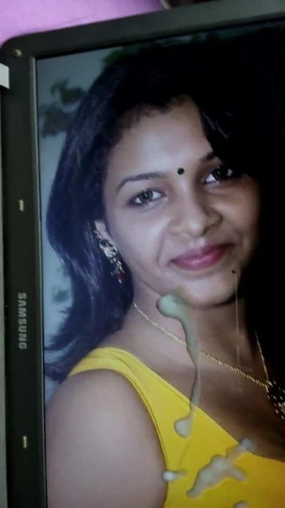 cumming on Saranya Nag yellow blouse and face