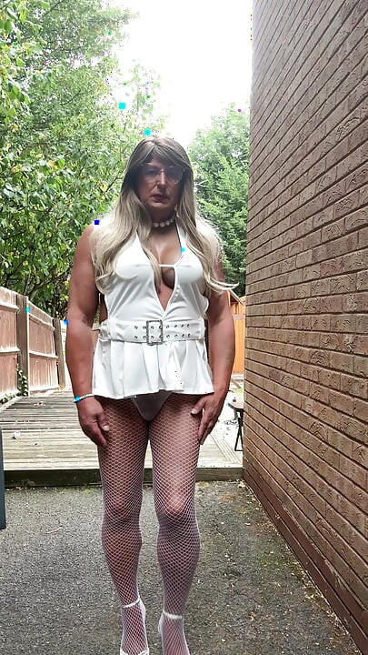 Sexy Crossdresser kellycd2022 in sexy white mini dress and fishnet pantyhose and heels