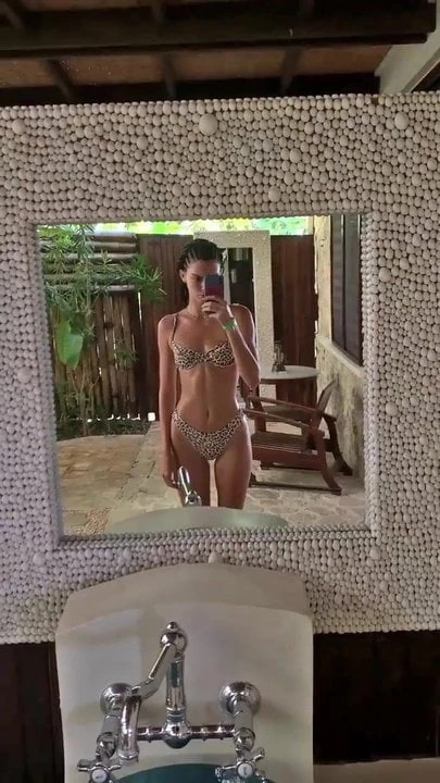 'Kendall J.' in leopard print bikini, selfie