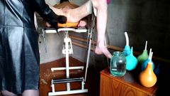 Mistress washes slave's ass with 2 different enema bulbs